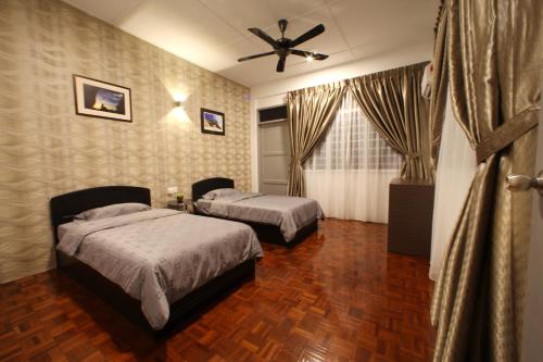 Katil atau katil-katil dalam bilik di Come Inn Homestay 1380