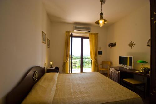 Postel nebo postele na pokoji v ubytování Hotel Le Cave