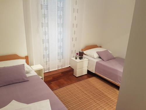 Posteľ alebo postele v izbe v ubytovaní Penthouse Znjan