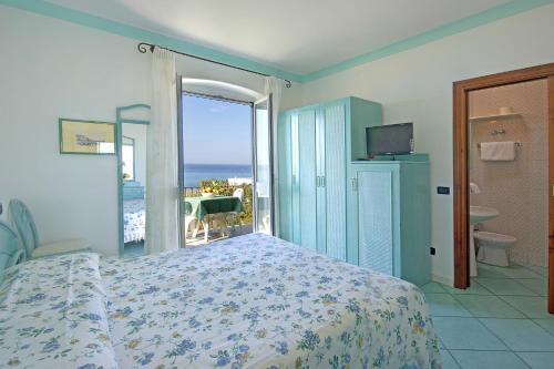 Кровать или кровати в номере Hotel Casa del Sole