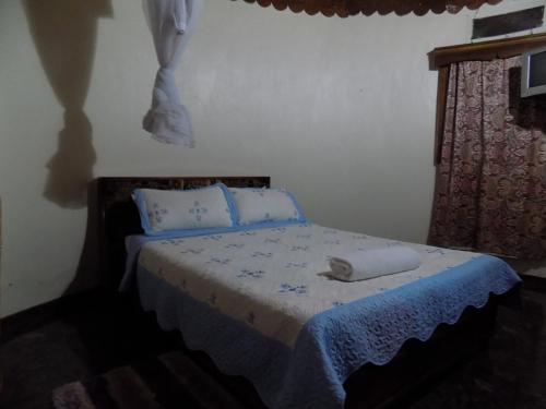Voodi või voodid majutusasutuse Tooro Resort Hotel toas