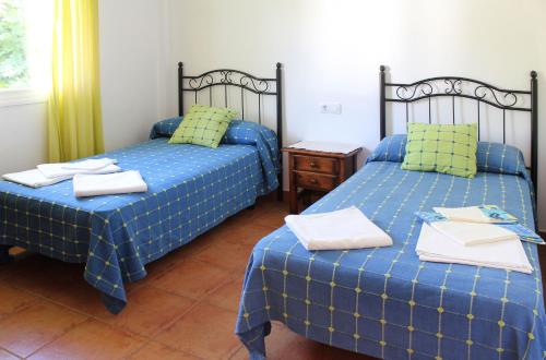 A bed or beds in a room at Casa Gil - La Vega