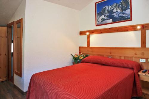 Cama o camas de una habitación en Albergo Le Marmotte