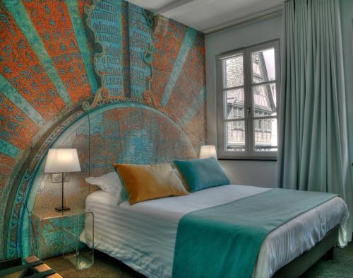Postel nebo postele na pokoji v ubytování Hotel Cathédrale