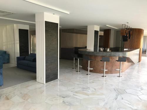 a living room with a marble floor at Hotel do Parque in Viana do Castelo