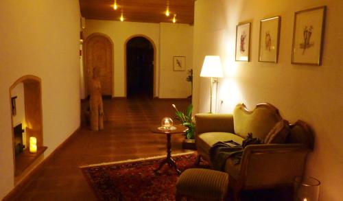 a living room with a couch and a table at B&B Villa Stelvio in Sta Maria Val Müstair