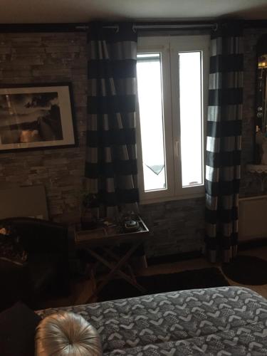 Ένα ή περισσότερα κρεβάτια σε δωμάτιο στο Chambres d'hôtes La Fougereuse