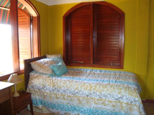 Ένα ή περισσότερα κρεβάτια σε δωμάτιο στο Fuego Mio Bed & Breakfast