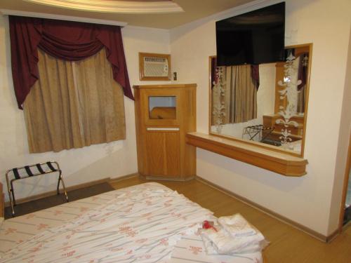 Pleasant Place Hotelにあるベッド
