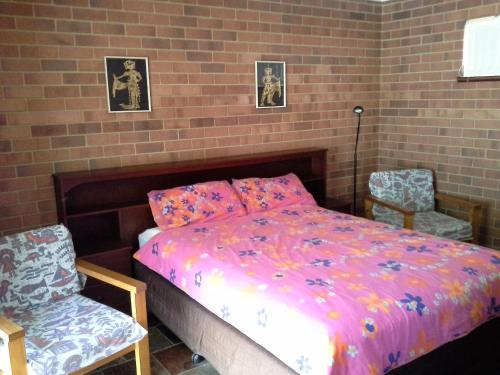 Een bed of bedden in een kamer bij Busselton Beachfront