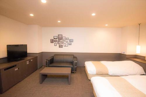 Ένα ή περισσότερα κρεβάτια σε δωμάτιο στο Hotel Double Funabashi