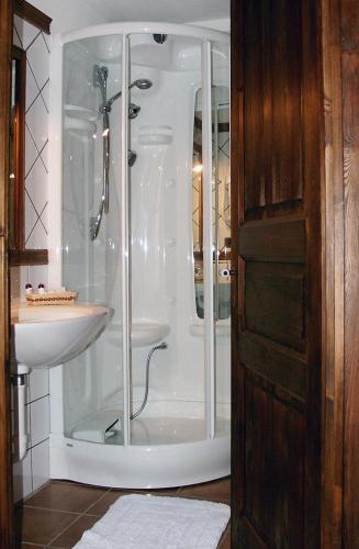 a bathroom with a shower and a sink at Le Village in Montjovet