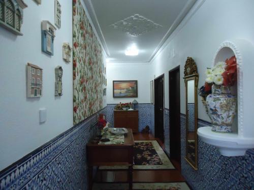 a hallway with a sink and a toilet in a room at Cascais Jasmim Doce in Cascais