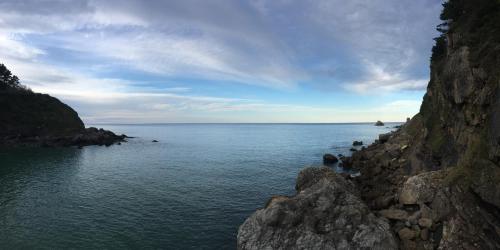a view of a large body of water with rocks at Bekale in Ea