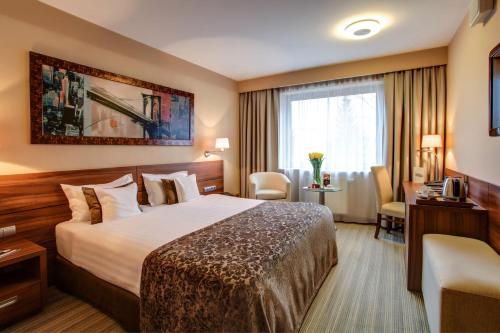 Postel nebo postele na pokoji v ubytování Haston City Hotel