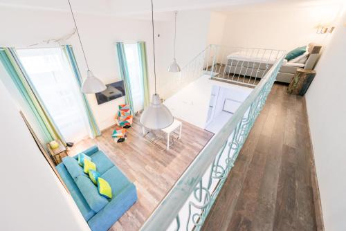 an overhead view of a living room and a kitchen at Tamara Apartman in Budapest