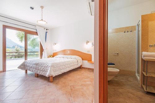 Säng eller sängar i ett rum på Rifugio Gorropu