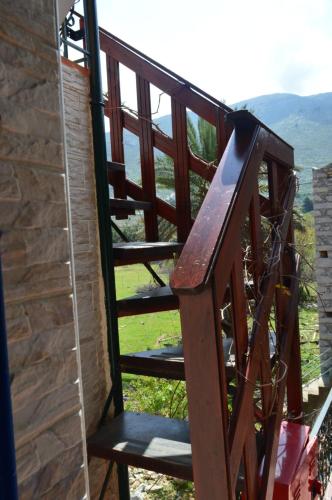 a wooden staircase with a view of a mountain at "STELIOS & GALINI" in Symi