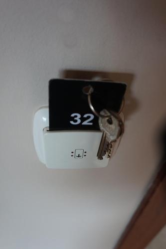 a alarm clock with a bunch of keys on it at Hostal Alamare in Seville