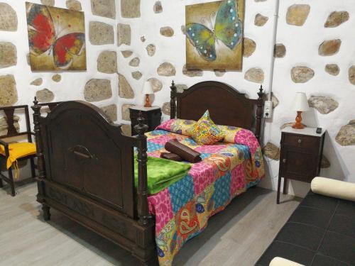Giường trong phòng chung tại La Piedra Viva Agüimes , Siete hermanos