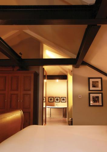 a view of a bedroom with a bed and a hallway at Hotel Du Vin & Bistro York in York