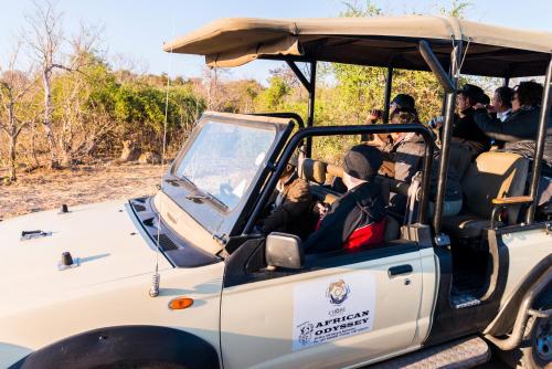 a group of people in a safari vehicle at Chobe Marina Lodge in Kasane