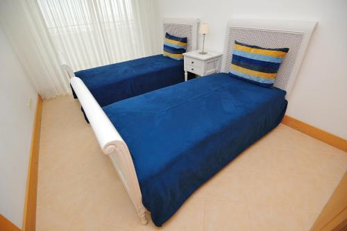En eller flere senge i et værelse på Oceano Atlantico Apartamentos Turisticos
