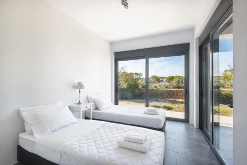 Posteľ alebo postele v izbe v ubytovaní Minimal Sea View Maisonette