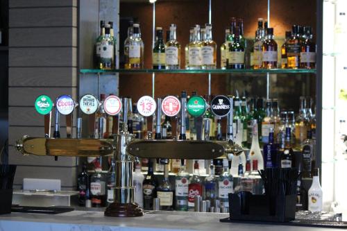 a bar with a bunch of bottles of alcohol at Sligo Park Hotel & Leisure Club in Sligo