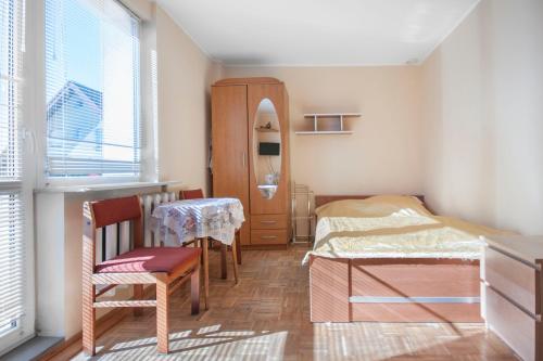 Postel nebo postele na pokoji v ubytování Roza Wiatrow