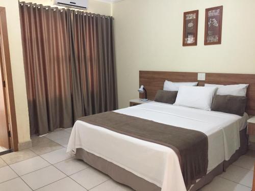 Ένα ή περισσότερα κρεβάτια σε δωμάτιο στο Silver Lis Hotel