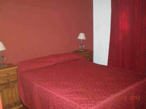 Ένα ή περισσότερα κρεβάτια σε δωμάτιο στο Carlos Sosa