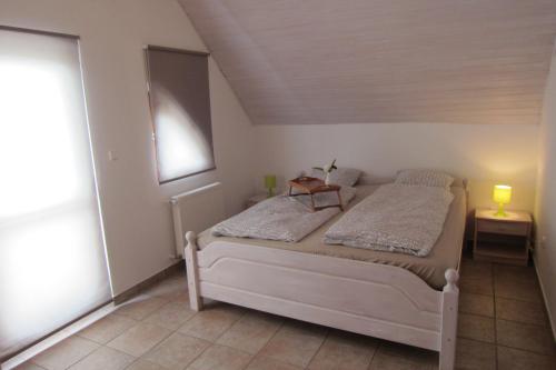 a bedroom with a bed in a room at Villa Brizo in Balatongyörök