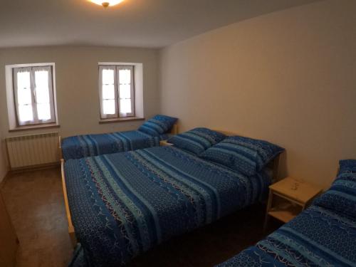 Un pat sau paturi într-o cameră la Lesjakova Domačija