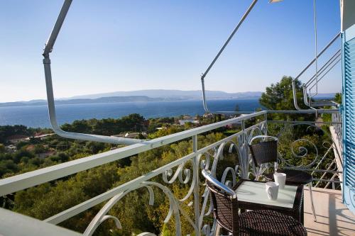 a gondola ride with two chairs and a table at Irini Apartment in Lassi