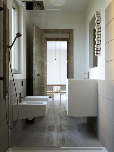 a bathroom with a tub and a sink and a shower at Camarò Favignana in Favignana