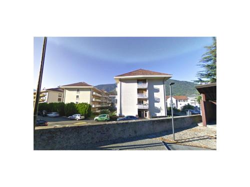 a view of a building with a parking lot at Apartments Sissi & Franz in Merano