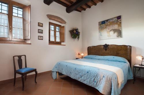 Giường trong phòng chung tại Casa Vacanze Villa il Castellaccio