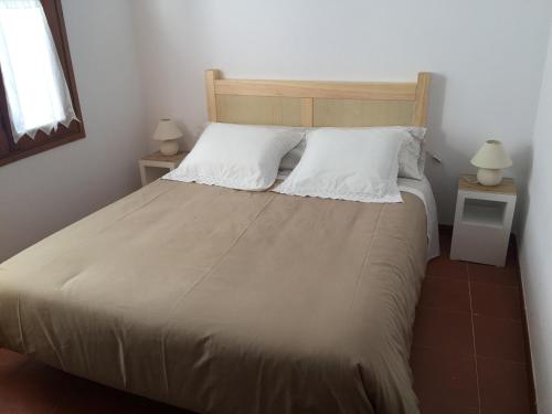 Ένα ή περισσότερα κρεβάτια σε δωμάτιο στο Casa Neus