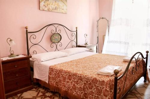 Postel nebo postele na pokoji v ubytování B&B Arcobaleno