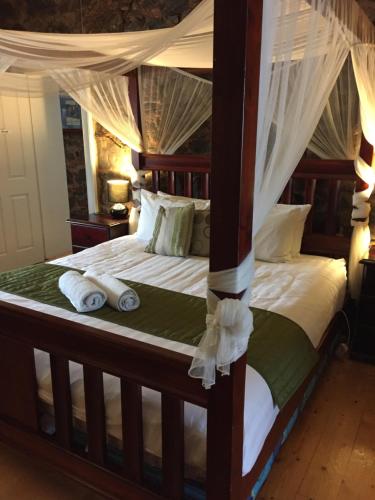 a bedroom with two beds with white sheets and pillows at Little River Bed and Breakfast in Little River