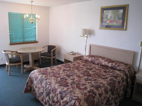 Un pat sau paturi într-o cameră la Crown Inn