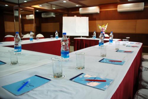 a table with glasses and bottles of water on it at Pan Asia Continental in Kolkata