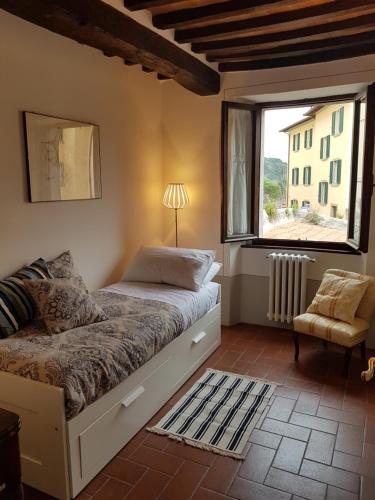 Un pat sau paturi într-o cameră la Casa dell'Ermanna