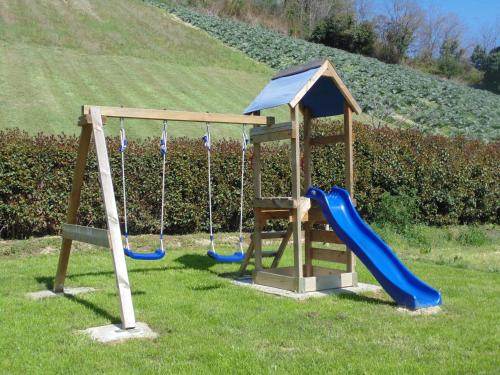a playground with a blue slide and a slideintend at Bigotti in Fano