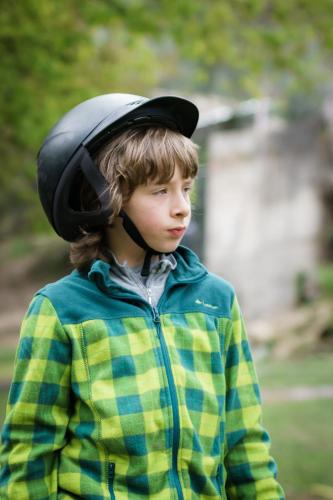 a young boy with a helmet on his head at Quinta Machado Da Pedra Bela in Geres