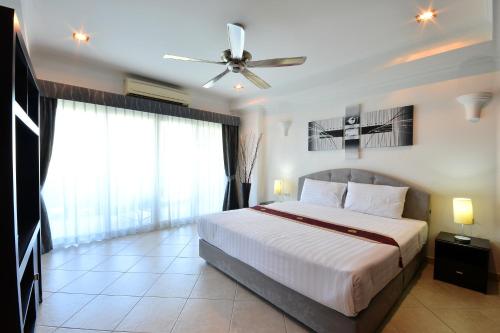 Ένα ή περισσότερα κρεβάτια σε δωμάτιο στο View Talay Residence 6 Wongamat Beach