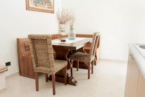 a dining room with a table and chairs at B&B Arcobaleno in Marittima