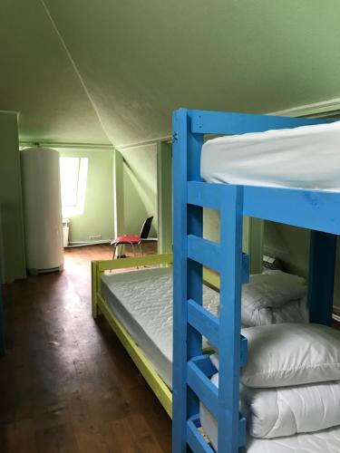 a room with two bunk beds in a tent at Hostel Darnitsa1 in Kyiv