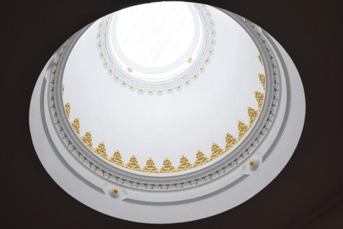 a white dome with gold designs on it at Lusitana Hotel in Porto